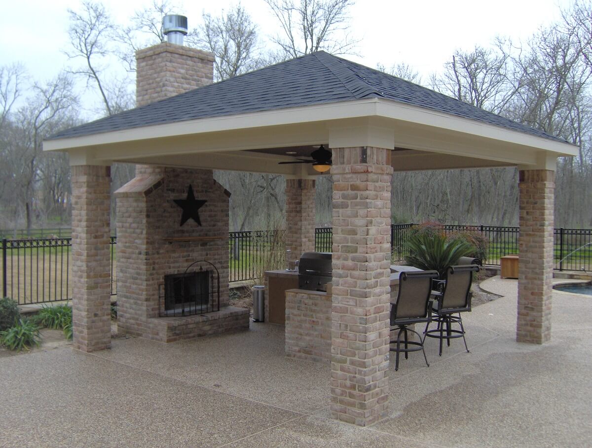 covered patio with fireplace